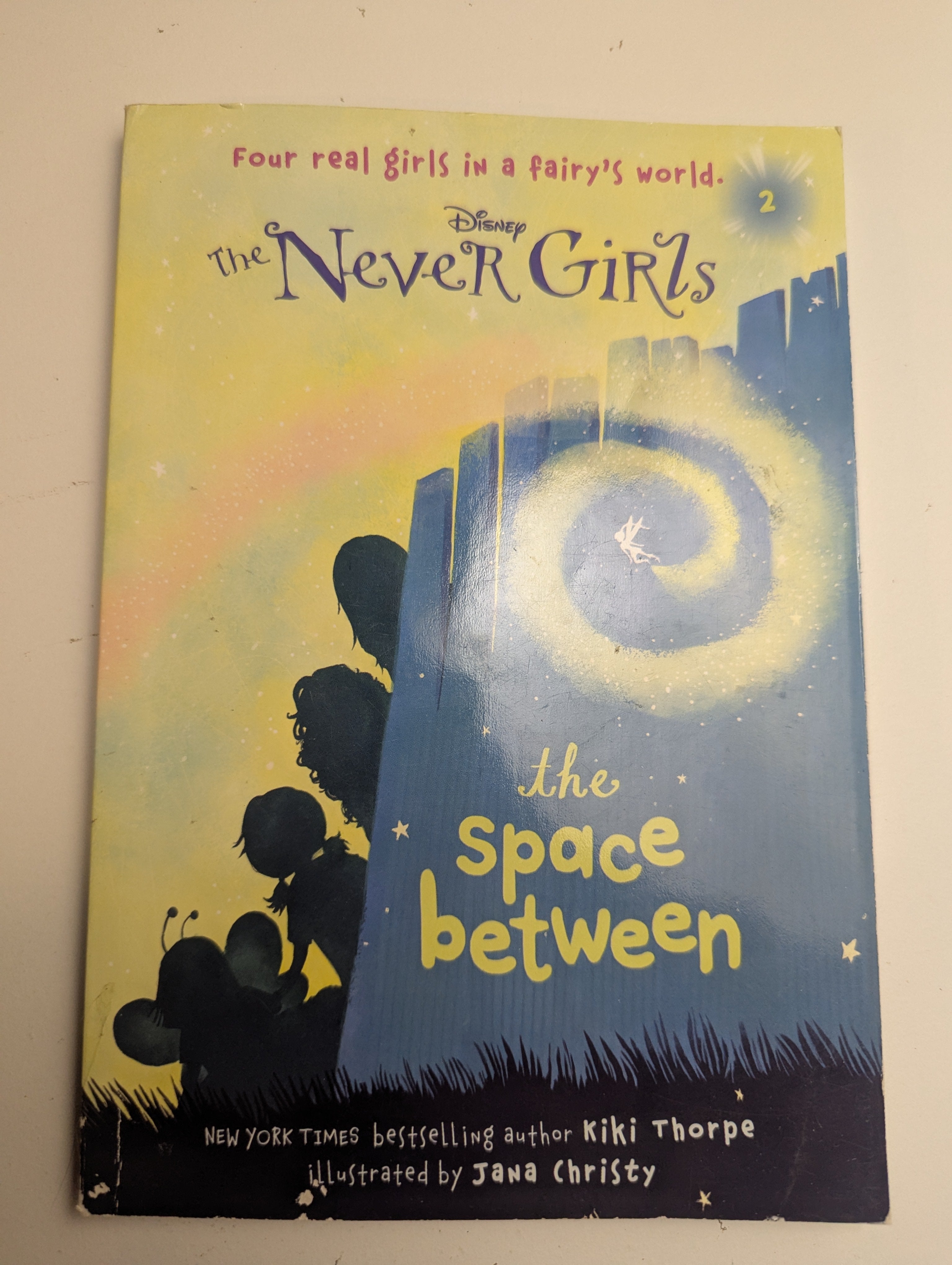 The Never Girls: The Space Between — by Kiki Thorpe - Lightly Used