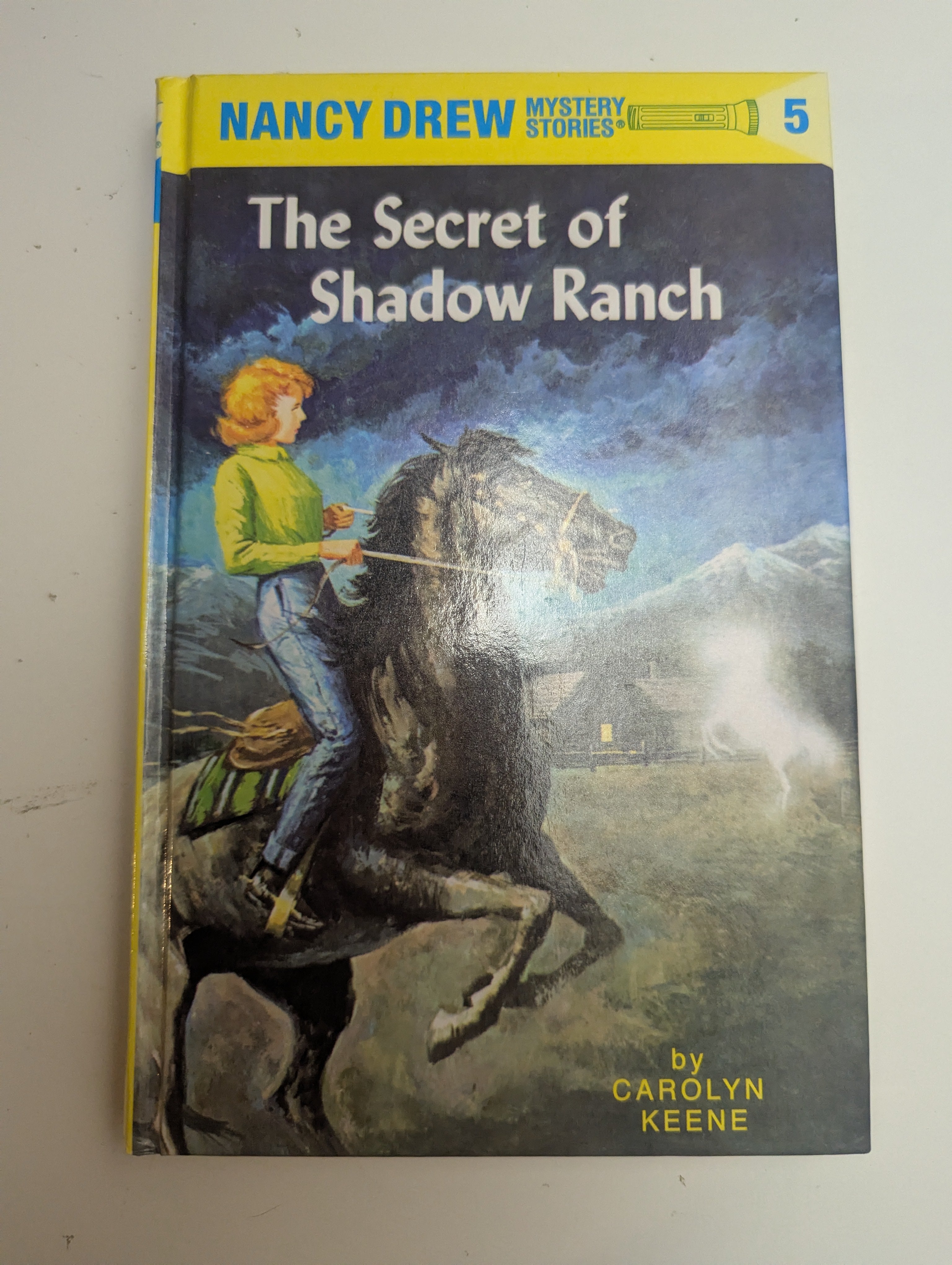 The Secret of Shadow Ranch — by Carolyn Keene - Lightly Used