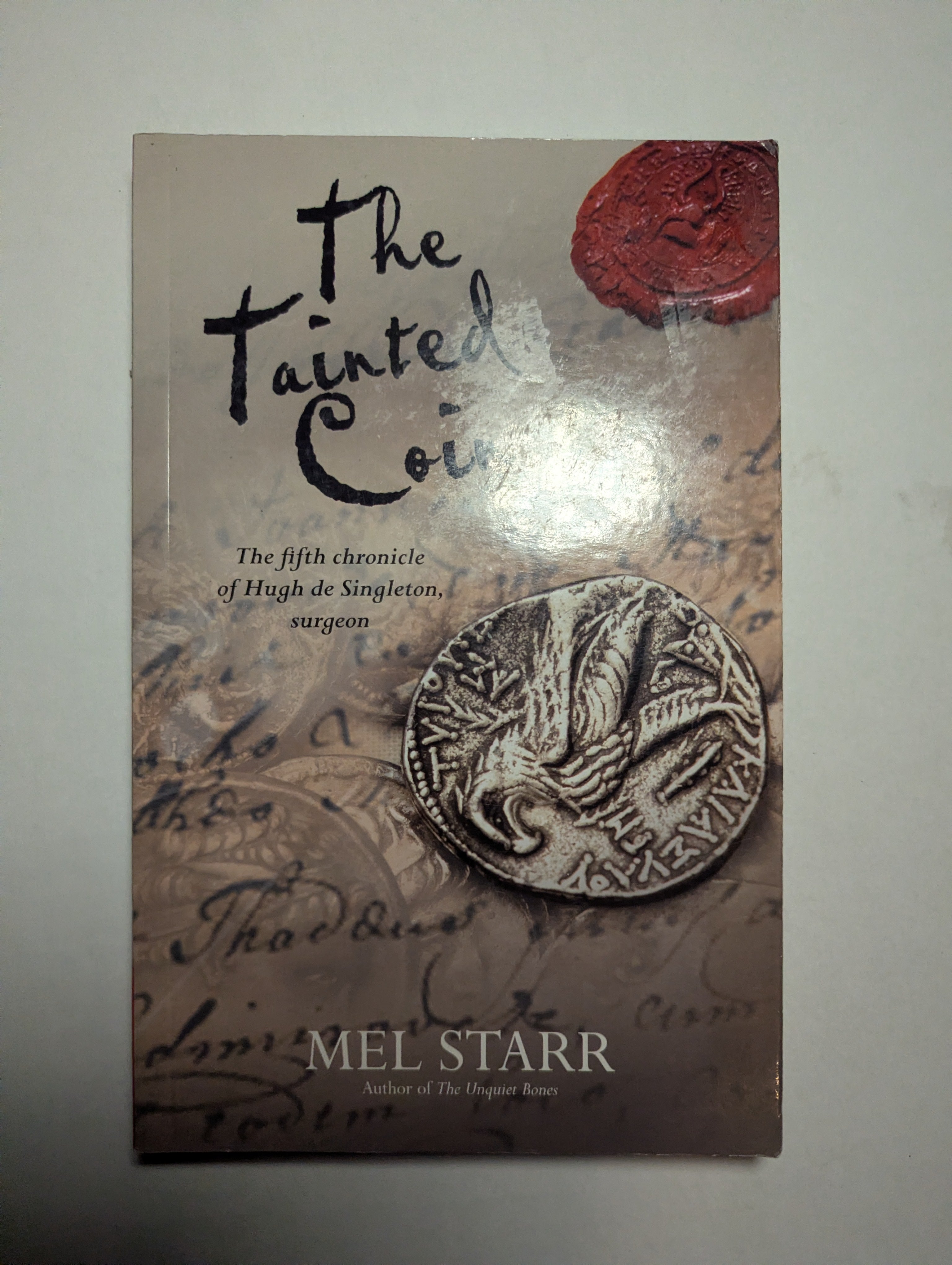 The Tainted Coin — by Mel Starr - Lightly Used
