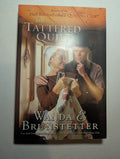 The Tattered Quilt — by Wanda E. Brunstetter - Lightly Used